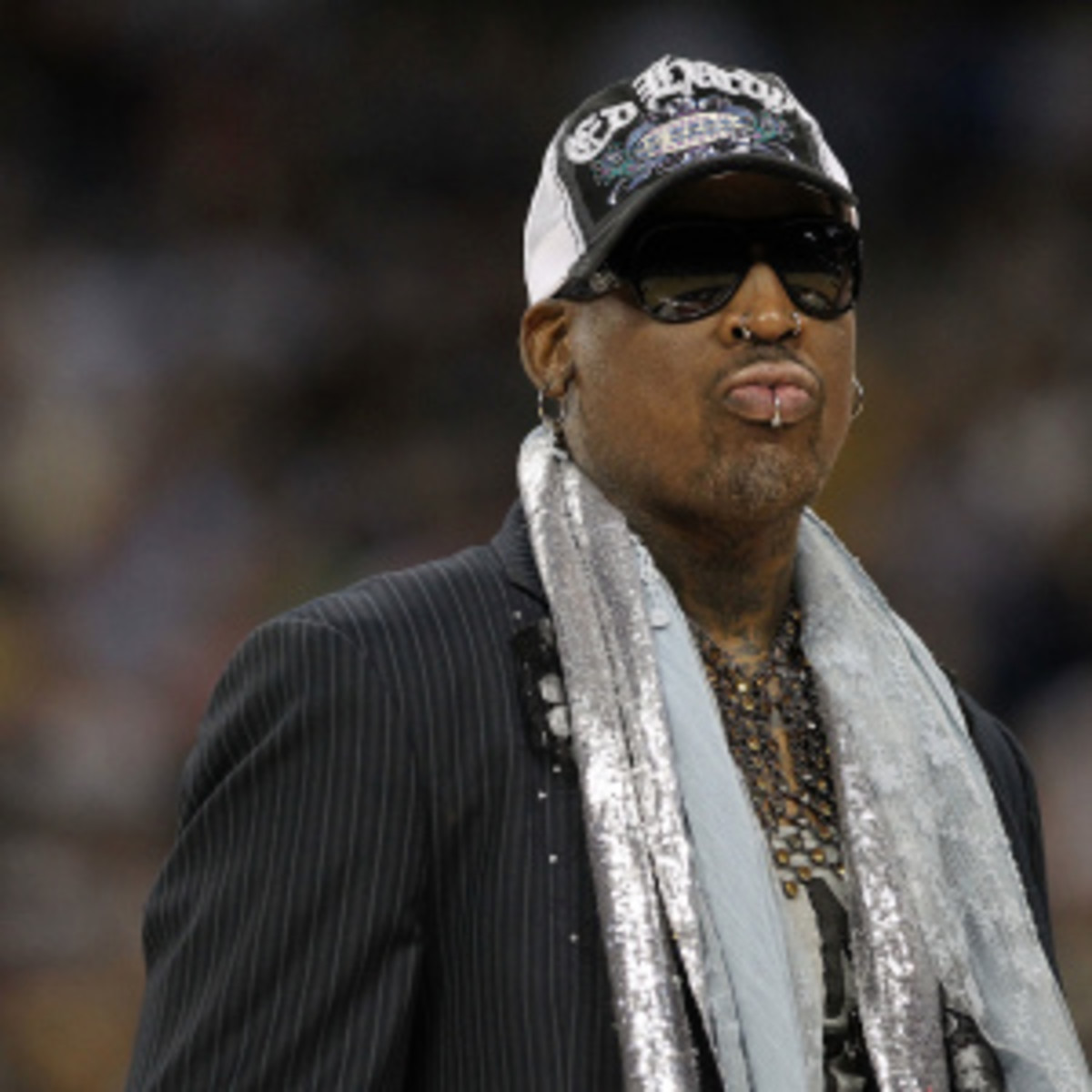 Dennis Rodman watched a basketball game in North Korea with leader Kim Jong Un on Thursday. (Ronald Martinez/Getty Images)